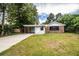 Brick home with carport and landscaping at 415 Lucille St, Bartow, FL 33830