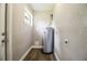 Laundry room with new water heater and flooring at 415 Lucille St, Bartow, FL 33830