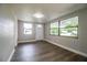 Living room with hardwood floors and large windows at 415 Lucille St, Bartow, FL 33830