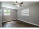 Bedroom with wood-look floors and built-in shelving at 415 Lucille St, Bartow, FL 33830