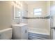 Updated bathroom with tub and mosaic tile at 415 Lucille St, Bartow, FL 33830