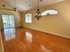 Spacious living room with hardwood floors and high ceilings at 1045 Caravan Loop, Polk City, FL 33868
