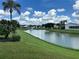 Peaceful backyard view of a canal and community homes at 1045 Caravan Loop, Polk City, FL 33868