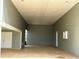 Covered carport with concrete flooring and storage at 1045 Caravan Loop, Polk City, FL 33868