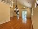 Bright and airy living room with hardwood floors and high ceilings at 1045 Caravan Loop, Polk City, FL 33868