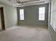 Spacious bedroom with carpet and multiple windows at 1045 Caravan Loop, Polk City, FL 33868