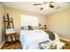 Bedroom featuring hardwood floors, a ceiling fan, and window at 7525 Catherine Dr, Lakeland, FL 33810