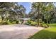 Ranch style home with mature landscaping and a large driveway at 7525 Catherine Dr, Lakeland, FL 33810