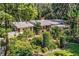Ranch home with landscaped yard and large oak trees at 7525 Catherine Dr, Lakeland, FL 33810