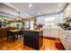 Kitchen features white cabinets, island, and hardwood floors at 7525 Catherine Dr, Lakeland, FL 33810