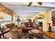 Cozy living room with a leather sofa, fireplace, and built-in shelving at 7525 Catherine Dr, Lakeland, FL 33810