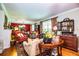 Bright living room boasts hardwood floors, comfortable seating, and antique furnishings at 7525 Catherine Dr, Lakeland, FL 33810