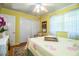 Cozy bedroom with yellow walls, a queen bed, and ample closet space at 7525 Catherine Dr, Lakeland, FL 33810