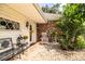 Inviting front porch with brick flooring and rocking chair at 7525 Catherine Dr, Lakeland, FL 33810