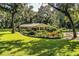 Ranch home with mature landscaping and lush lawn at 7525 Catherine Dr, Lakeland, FL 33810