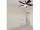 Bright bedroom with ceiling fan and access to bathroom at 206 Clovis Pass, Winter Haven, FL 33880