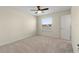 Spacious bedroom with a ceiling fan and window at 206 Clovis Pass, Winter Haven, FL 33880