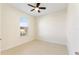 Spacious bedroom with tile flooring and a large window at 206 Clovis Pass, Winter Haven, FL 33880