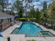 Community pool with spa and lake view at 3141 Stonewater Dr, Lakeland, FL 33803