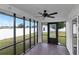 Relaxing screened porch with brick tile floor and ceiling fan at 4618 Crestview Ln, Lakeland, FL 33813