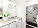 Spa-like bathroom with white cabinets, granite countertop, and marble shower at 4618 Crestview Ln, Lakeland, FL 33813