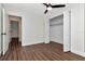 Simple bedroom with hardwood floors and double-door closet at 4618 Crestview Ln, Lakeland, FL 33813