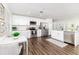 Modern kitchen boasts white cabinets, stainless steel appliances, and an island at 4618 Crestview Ln, Lakeland, FL 33813