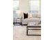Bright living room features stylish sofa, coffee table, and end tables at 4618 Crestview Ln, Lakeland, FL 33813