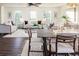 Bright living room features stylish sofas, coffee table, and dark hardwood floors at 4618 Crestview Ln, Lakeland, FL 33813