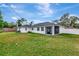 Back exterior view showing screened porch and yard at 4618 Crestview Ln, Lakeland, FL 33813