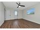 Bedroom with wood-look floors, ceiling fan and exterior access at 4618 Crestview Ln, Lakeland, FL 33813