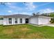 Ranch-style house with a white exterior and modern garage door at 4618 Crestview Ln, Lakeland, FL 33813