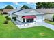 Cute single story home with a burgundy awning at 6205 Raven Run, Lakeland, FL 33809