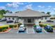 Community clubhouse exterior with ample parking at 6205 Raven Run, Lakeland, FL 33809