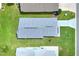 Aerial view of a single-Gathering home with a gray roof, located in a residential neighborhood at 6205 Raven Run, Lakeland, FL 33809