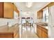 Galley kitchen with ample cabinetry, and adjacent dining area at 6205 Raven Run, Lakeland, FL 33809