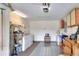 Laundry room with washer, dryer and storage shelves at 6205 Raven Run, Lakeland, FL 33809