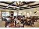 Elegant dining area with numerous tables and chairs at 6205 Raven Run, Lakeland, FL 33809