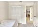 Small bedroom with a closet and access to another room at 6205 Raven Run, Lakeland, FL 33809