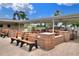 Community BBQ area with picnic tables and benches at 6205 Raven Run, Lakeland, FL 33809