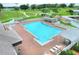 Resort-style pool with spa and plenty of lounge chairs at 6205 Raven Run, Lakeland, FL 33809