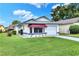 Single story home with attached garage and awning at 6205 Raven Run, Lakeland, FL 33809