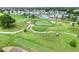 Aerial view of community, golf course, and clubhouse at 6205 Raven Run, Lakeland, FL 33809