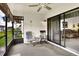Bright screened porch with access to the backyard and living room at 6205 Raven Run, Lakeland, FL 33809
