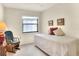 Cozy bedroom with a twin-sized bed and a rocking chair at 6205 Raven Run, Lakeland, FL 33809
