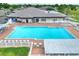 Community pool with surrounding patio and hot tub at 6205 Raven Run, Lakeland, FL 33809