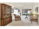 Living room featuring a large wooden cabinet and access to a screened patio at 6205 Raven Run, Lakeland, FL 33809