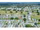 Aerial view showcasing a home's location in a community near a golf course at 6205 Raven Run, Lakeland, FL 33809