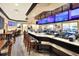 Large bar and restaurant with multiple screens and seating at 6205 Raven Run, Lakeland, FL 33809