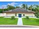 Community clubhouse with solar panels and landscaping at 6205 Raven Run, Lakeland, FL 33809